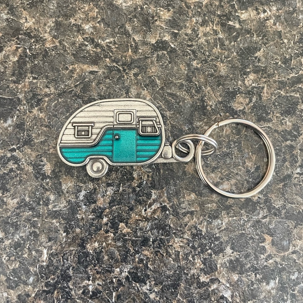 This beautiful key ring is NWOT. Great gift for a camper.